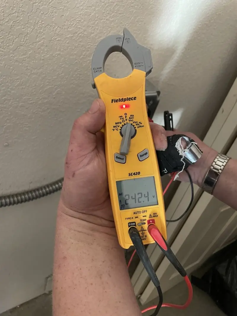 Voltage testing with clamp meter during Electrical Installation Services in Garden Acres